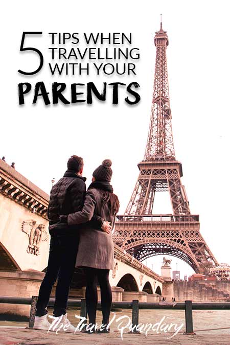 5 Tips When Travelling With Your Parents or In Laws A man and a woman stand down on the banks of the River Seine looking towards the Eiffel Tower, Paris, France