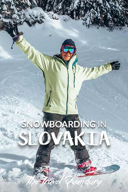 Bevan of the Travel Quandary stands on his snowboard with a victory pose, Jasna Resorts, Slovakia