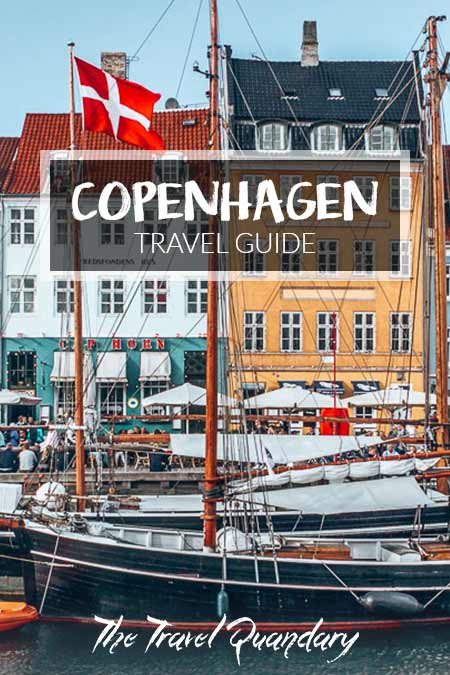 Copenhagen City Guide Pin to Pinterest: A boat on the colourful Nyhavn canal in Copenhagen, Denmark