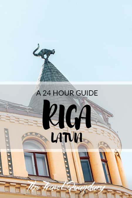 24 Hours in Riga Pin to Pinterest: One of the cats atop the Cat House in Riga, Latvia