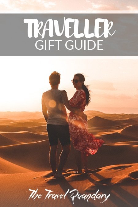 Traveller Gift Guide Pin to Pinterest: A couple enjoying the sunset over the dunes of the Sahara Desert, Morocco