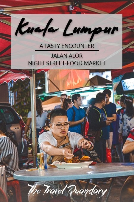 Jalan Alor Street Food Market Pin Pin to Pinterest: A man dishes his food seated at Wong Ah Wah