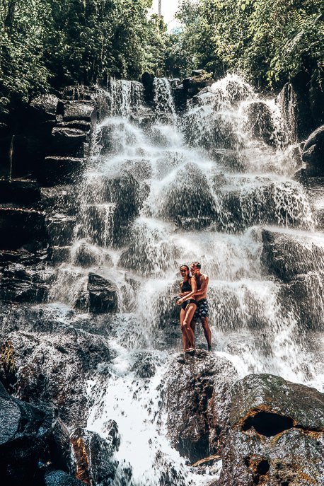 25 Incredible Photos Of Bali To Spark Your Wanderlust 10 P Jasmine and Bevan standing under Kanto Lampo waterfall, Bali Gallery