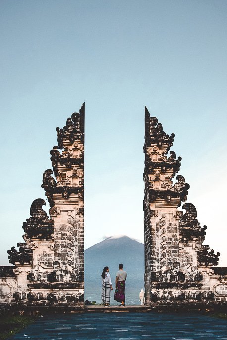 Jasmine and Bevan watching sunrise over Mount Ajung at the gates of Temple of Lempuyang Lehur, Bali Gallery