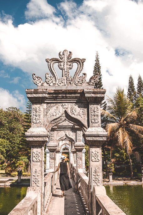 25 Incredible Photos Of Bali To Spark Your Wanderlust 16 P Jasmine walks under the arches of a walkway at Ujung Water Palace, Bali Gallery