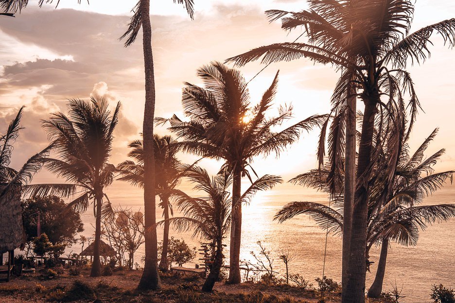 25 Incredible Photos Of Bali To Spark Your Wanderlust 20 L Sunrise through the palm at Thousand Islands, Nusa Penida, Bali Gallery