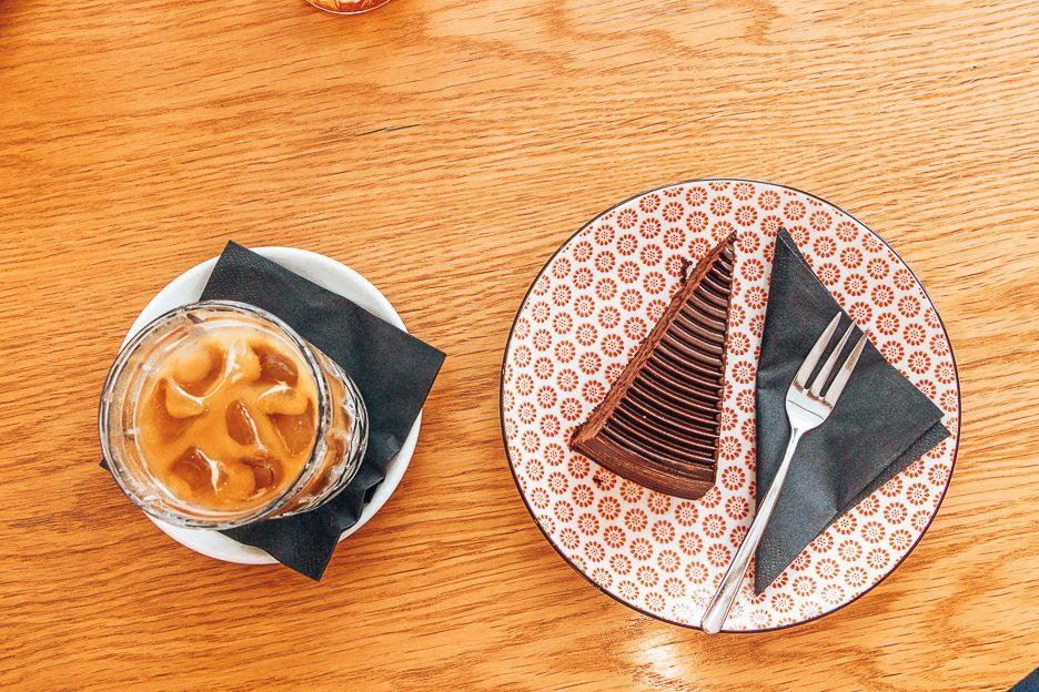 6 Amazing Third Wave Coffee Shops in Prague 5 L Iced coffee and chocolate cake at La Boheme Cafe, Prague