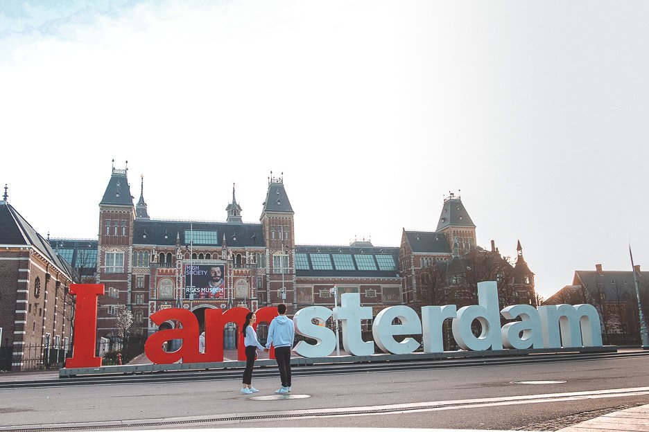 A Non Touristy Weekend Guide To Amsterdam 15 L Standing in front of the Iamsterdam sign at dawn, Amsterdam