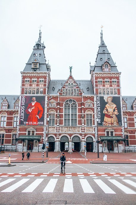 A Non Touristy Weekend Guide To Amsterdam 3 P Cycling in front of the Rijksmuseum, Amsterdam
