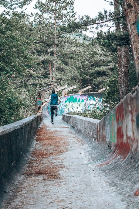 A One Day Itinerary For Sarajevo 3 P Bevan running down the abandoned bobsled track in Sarajevo, Bosnia & Herzegovina