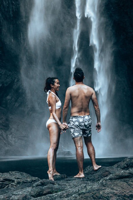 A Road Trip in Tropical North Queensland a 5 Day Campervan Itinerary from Cairns Back 10 P A couple stand underneath Wallaman Falls. Australia's largest single drop waterfall in tropical north Queensland