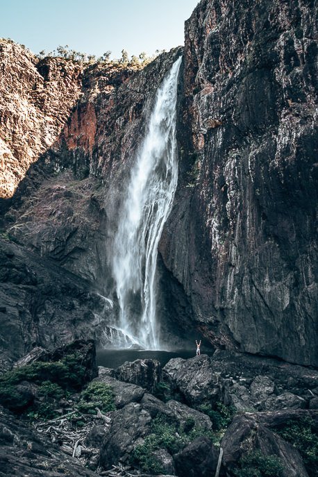 A Road Trip in Tropical North Queensland a 5 Day Campervan Itinerary from Cairns Back 9 P A man stands on a rock at the bottom of Wallaman Falls, Girringun National Park, Queensland