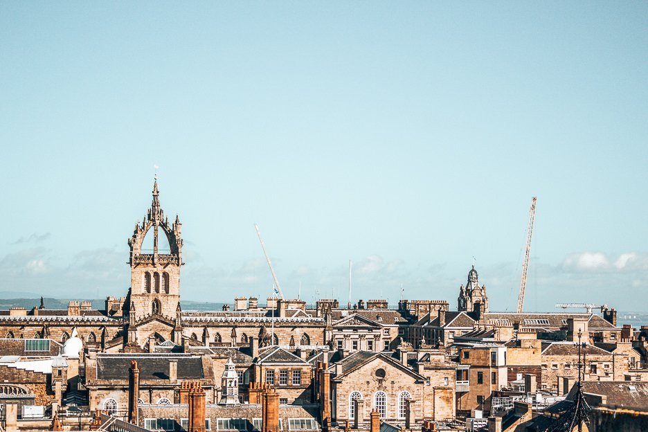 An Unmissable Guide To 48 Hours In Edinburgh 12 L The rooftops of the city under a blue sky, Edinburgh