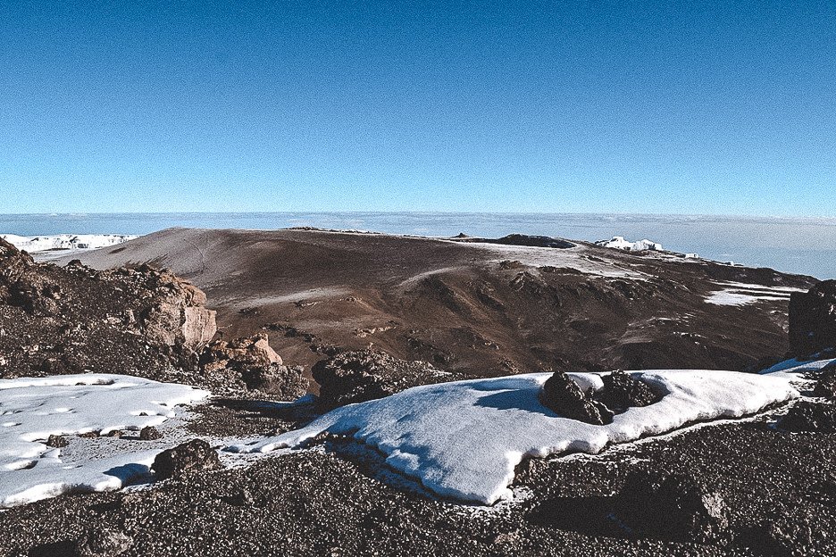 View of the mountains and snow from Uhuru Peak, summit of Kilimanjaro