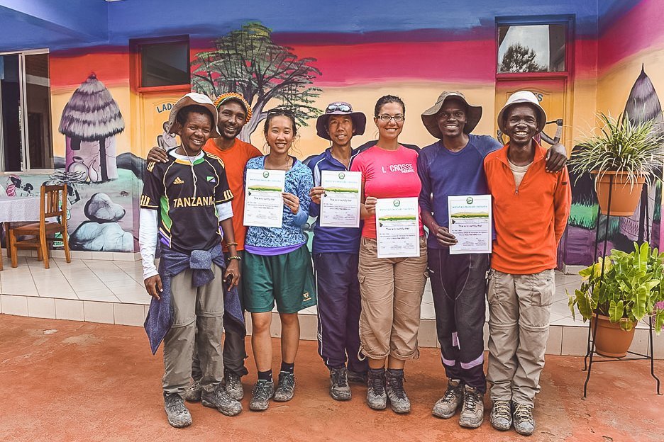 The group receiving their certificates after successfully summitting Mt Kilimanjaro