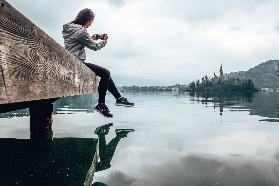 How To Escape The City A Weekend In Lake Bled 11 L Taking an iPhone photo of Bled Island, Bled Lake, Slovenia
