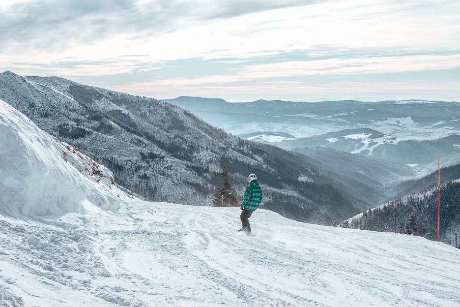 A lone snowboarder on the slopes at Jasna Nizke Tatry - Snowboarding in Slovakia
