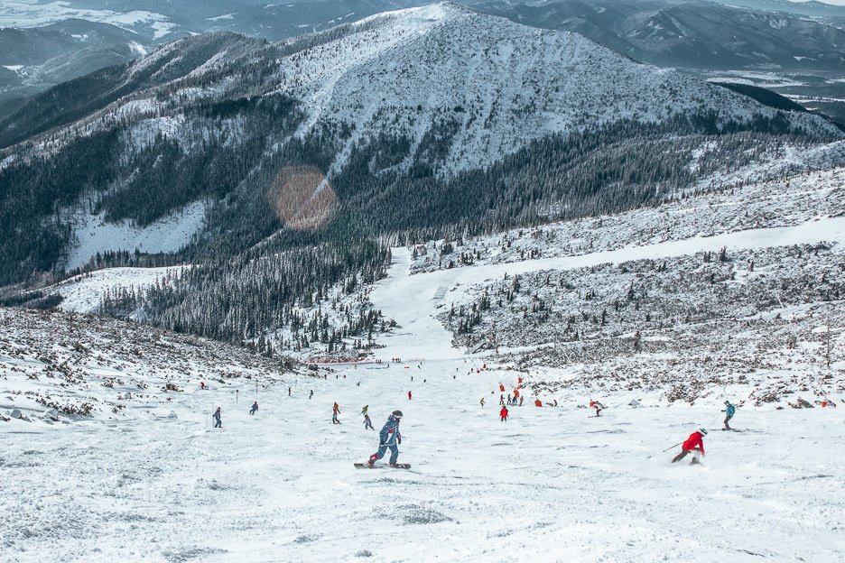 Skiiers and snowboarders hit the slopes at Jasna Nizke Tatry