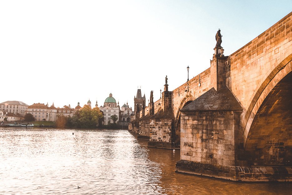 How To See Prague In 2 Days 15 L Sunrise over the Vlatva River underneath the Charles Bridge, Prague