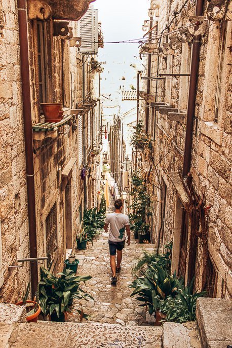 Bevan walks down steep stairs of Dubrovnik Old Town, Croatia