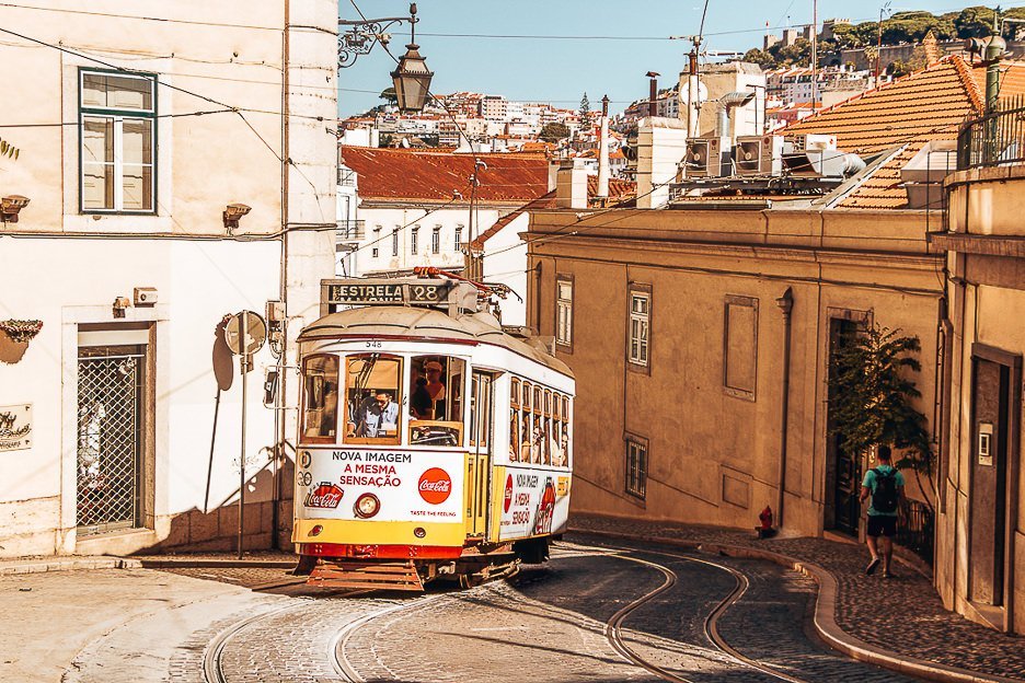 How To Spend The Perfect 3 Days In Lisbon 19 L Yellow tram 28 rumbling up the hill - Lisbon, Portugal