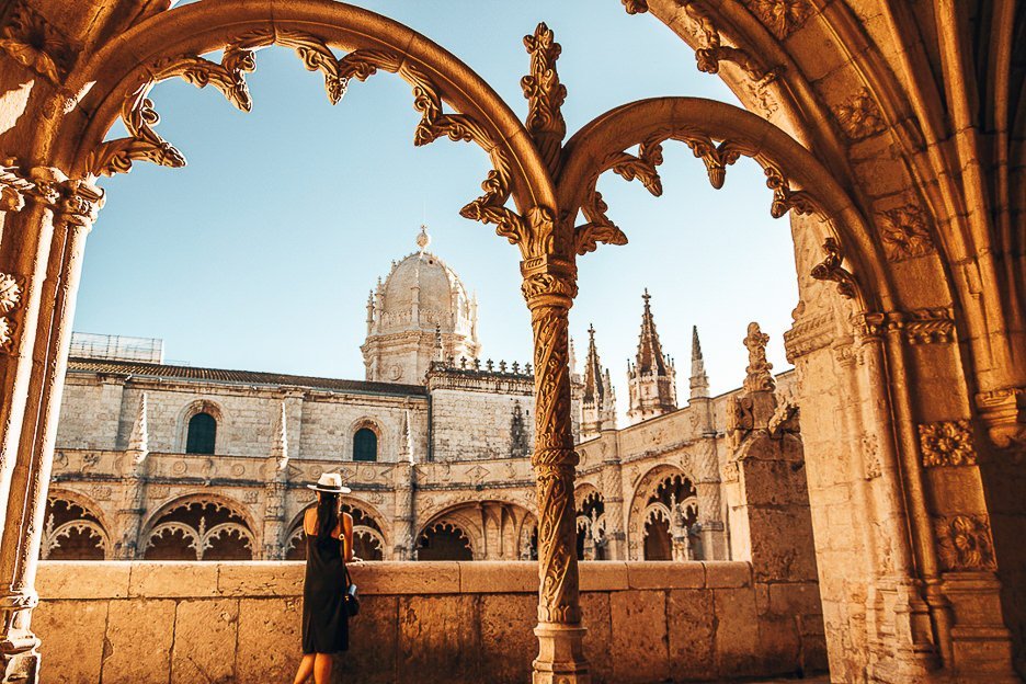 How To Spend The Perfect 3 Days In Lisbon 6 L Jasmine stands on one of the balconies under intricate arches of Jeronimos Monastery - Belem, Portugal