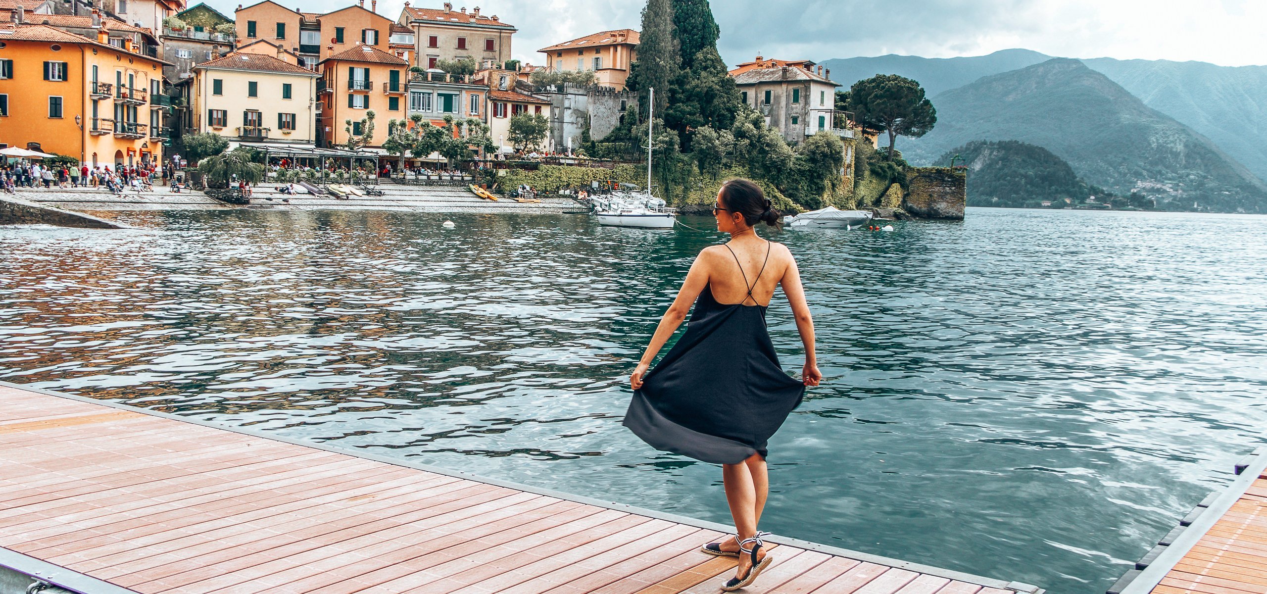 Twirling in a black dress on a pontoon at Varenna, Lake Como, Italy