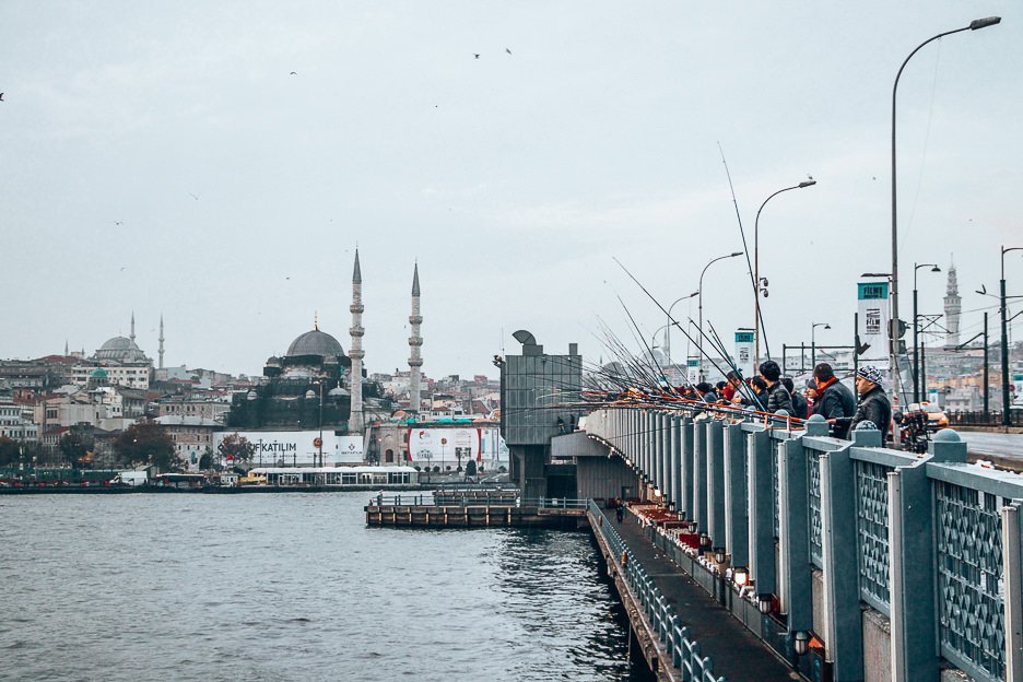 Fisherman wait patiently on Galata Bridge - Istanbul City Guide