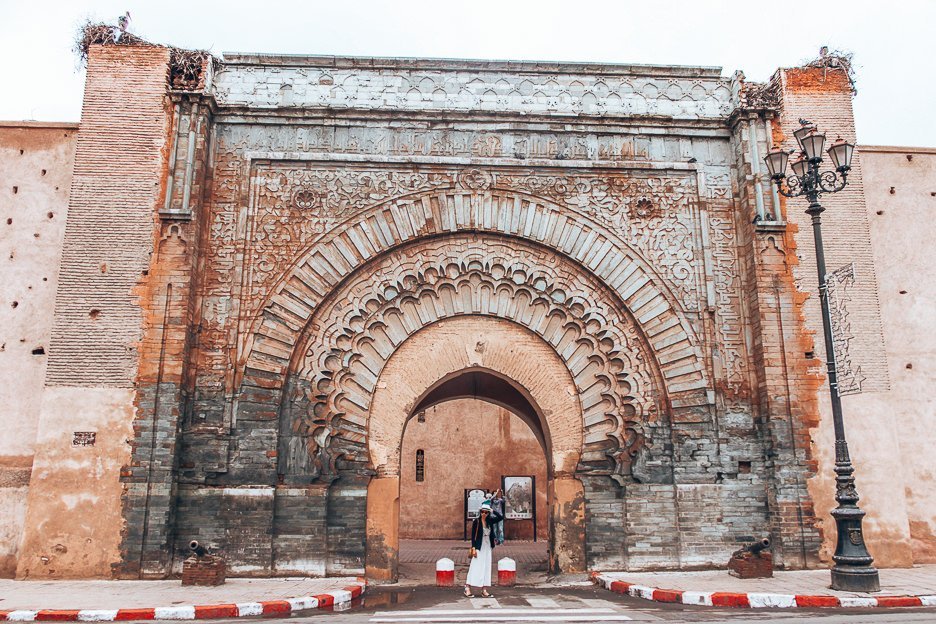 Morocco Travel Photography 35 Photos To Inspire You To Visit 12 L Jasmine poses in front of the imposing arch of Bab Er Robb, Marrakech, Morocco