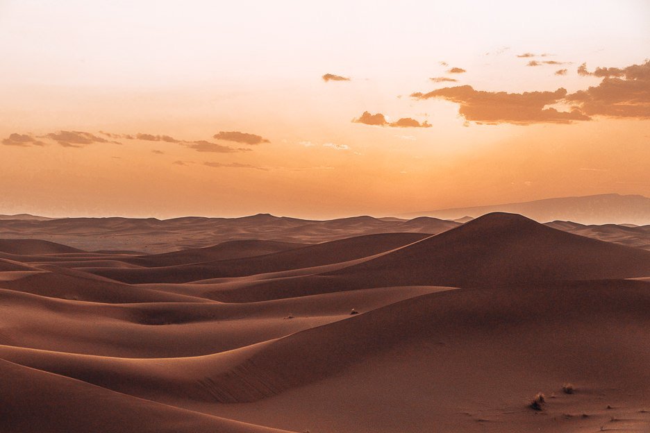 A golden sunset over the silken sand dunes of the Sahara Desert, Morocco