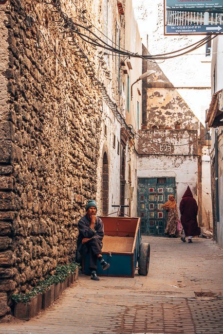 Morocco Travel Photography 35 Photos To Inspire You To Visit 23 P A man sits on his cart waiting for business in the streets of Essaouira, Morocco