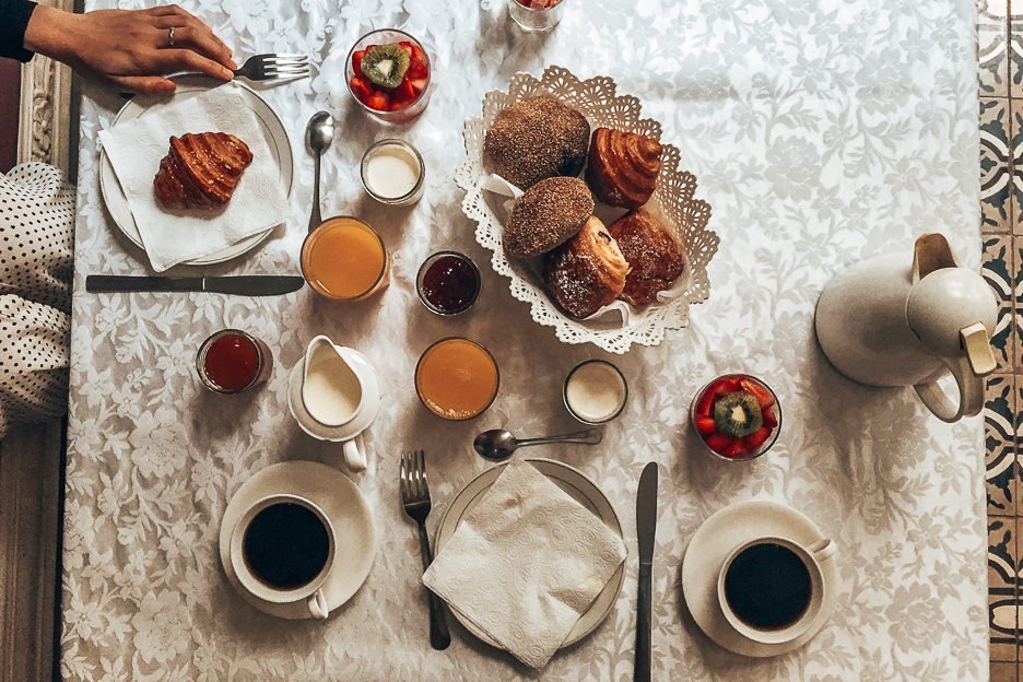 Morocco Travel Photography 35 Photos To Inspire You To Visit 27 L Breakfast spread of fresh pastries, yoghurt and fruits, orange juice and coffee at Riad Alnadine, Marrakech, Morocco