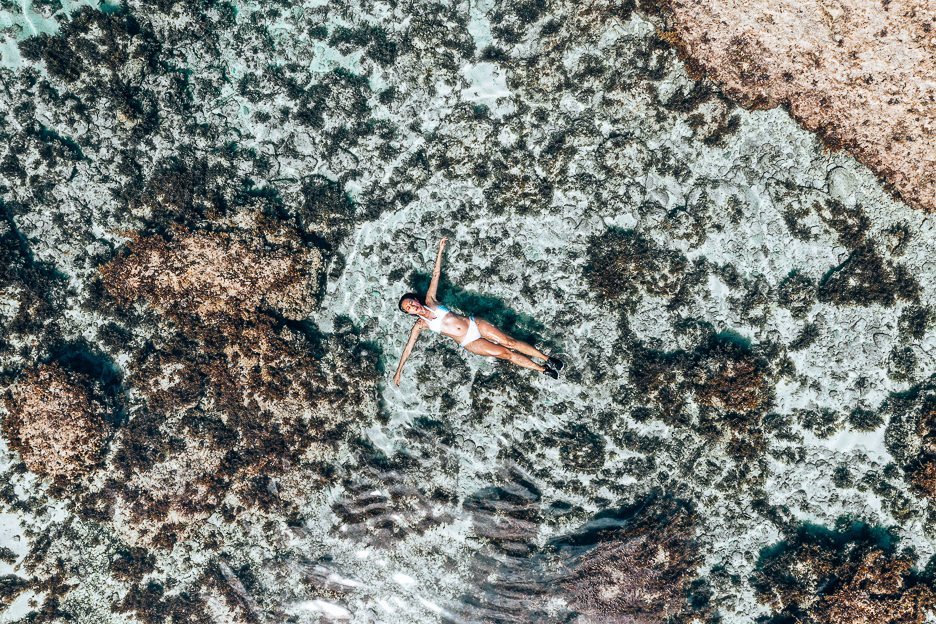 Siargao Island Travel Guide for Non Surfers 1 L A girl in a white bikini floats on her back in a tidal pool at Magpupungko, Siargao