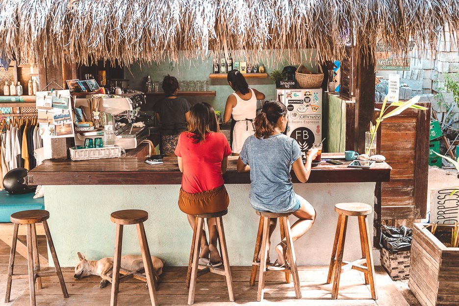 Customers sit at the coffee kiosk at Fili Beans Espresso - Cafe in Siargao