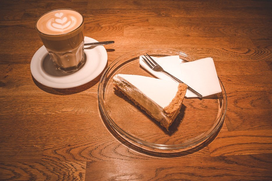 A latte and slice of cheesecake at Five Elephant, Berlin Germany