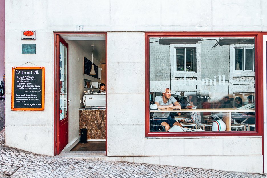 The Best Coffee In Lisbon 5 Cafes Not To Miss 7 L Sitting in the window of The Mill, Lisbon Portugal