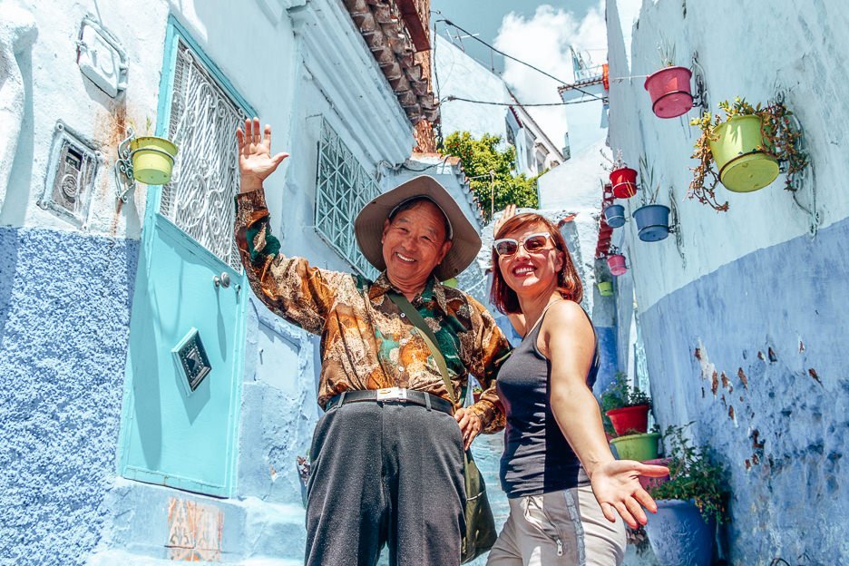 Two tourists pose for a photo in Chefchaouen Morocco
