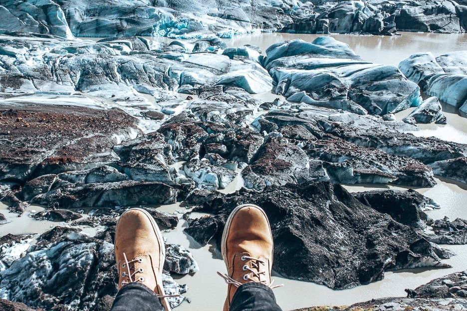 Through My Lens A Summer Adventure Through Iceland 7 L Shoes hanging out over the edge - Vatnajökull, Iceland