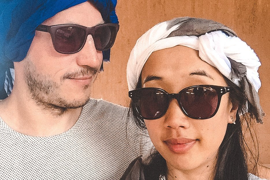 Bevan and Jasmine wearing Berber scarves before camel riding in Morocco