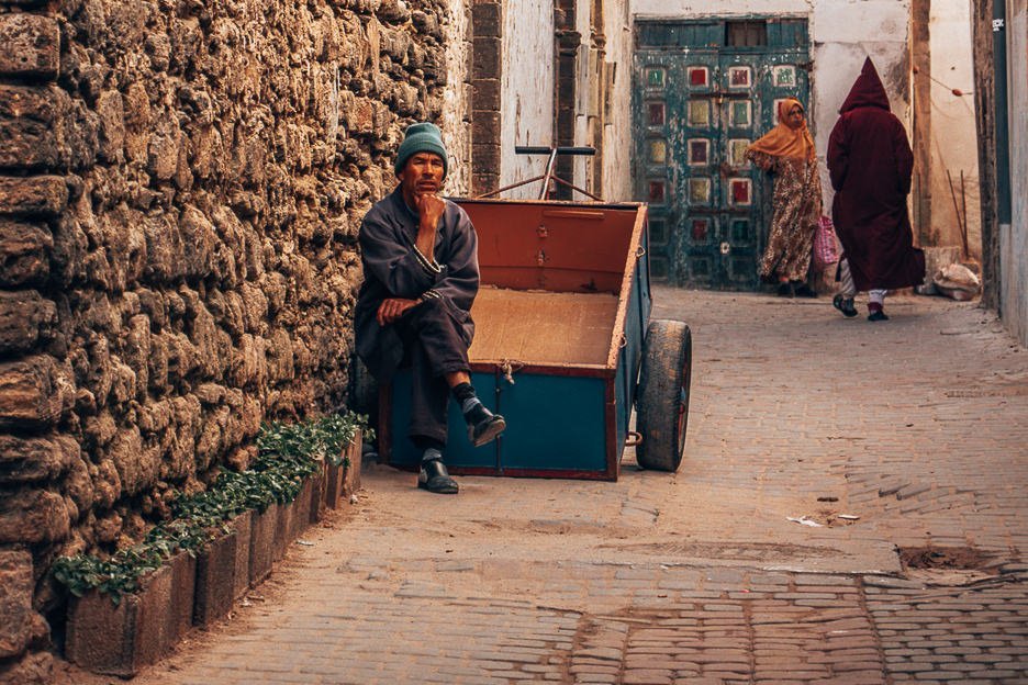 A man sits on his cart waiting for business in the streets of Essaouira, Morocco