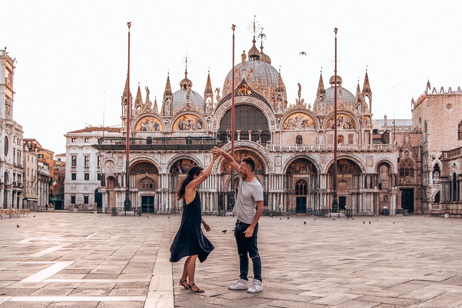 Dancing in front of St Mark's Cathedral in Piazza San Marco at sunrise, Venice