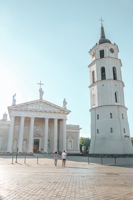 What We Learned From Our 50 Days European Campervan Trip 3 P A couple walk in front of Vilnius Cathedral at sunrise, Vilnius - 5 Things When Dating Travelling