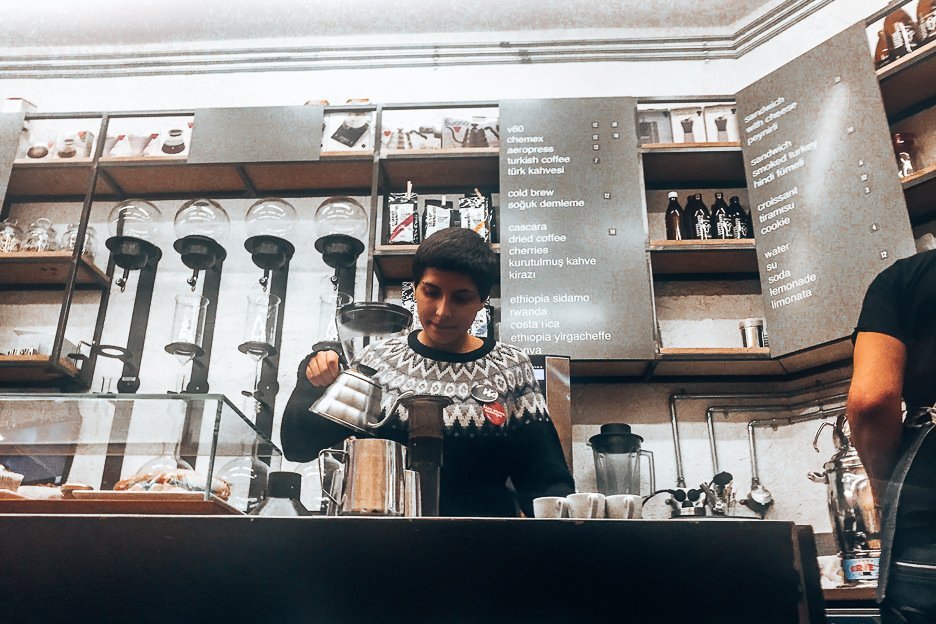 Baristra preparing Aeropress at Coffee Manifesto, Coffee in Istanbul