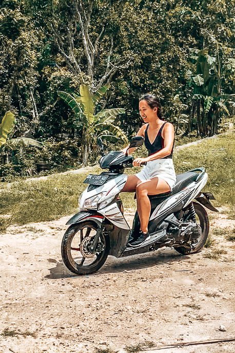 Jasmine riding a scooter in Nusa Penida | The Travel Quandary