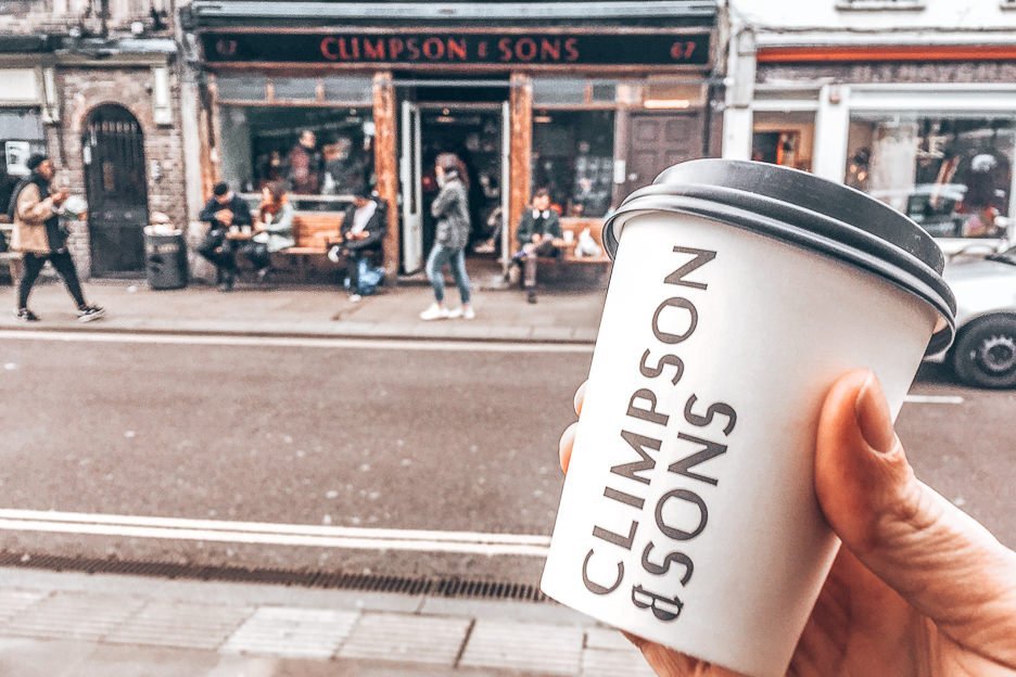 A takeaway coffee cup outside the Climpson & Sons flagship cafe in East London, England