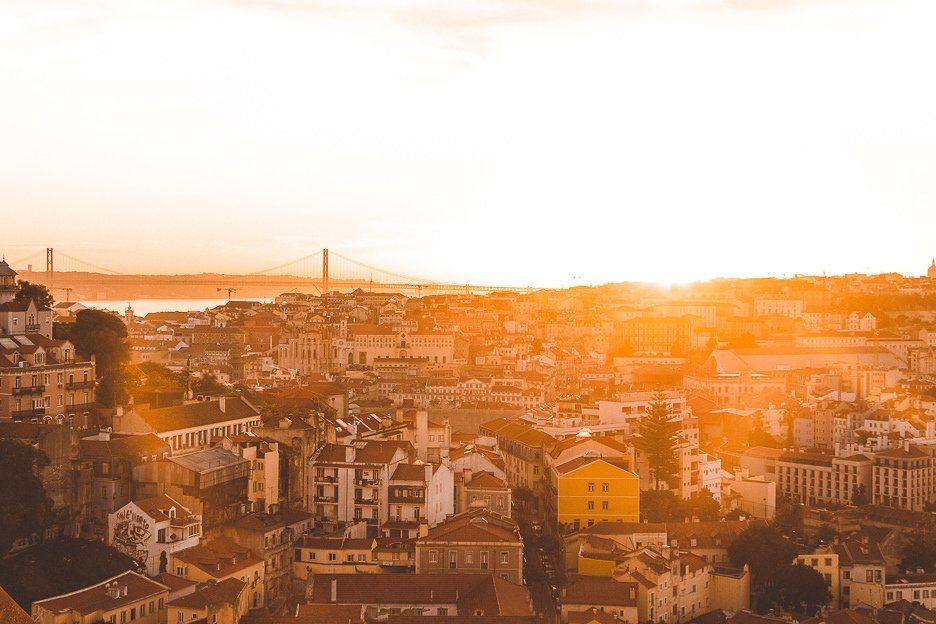 A golden sunset over the city of Lisbon, Portugal