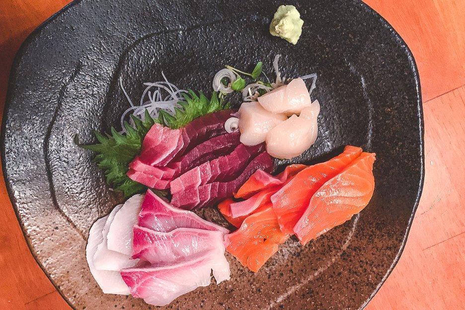 A plate of seafood sashimi - must try Japanese Food