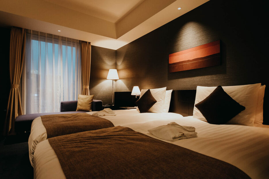 Two king single beds inside an Essential Hollywood Twin Room, The Gate Hotel Asakusa, Tokyo, Japan