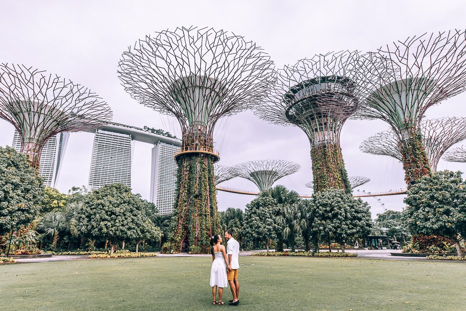 3 Day Itinerary in Singapore Things To Do Tips 15 L A couple stand on the lawn underneath the Supertree Grove at Gardens By The Bay, Singapore
