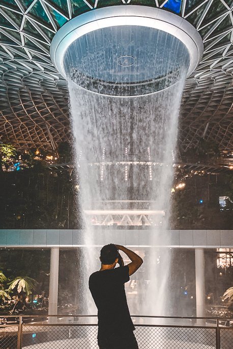 3 Day Itinerary in Singapore Things To Do Tips 4 P Snapping a photo of the waterfall at Jewel Changi Airport in the evening